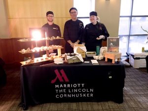 Culinary team booth at Savor the City. Left to right: Frank Tonini, Paul Brown, Emily Hansen.